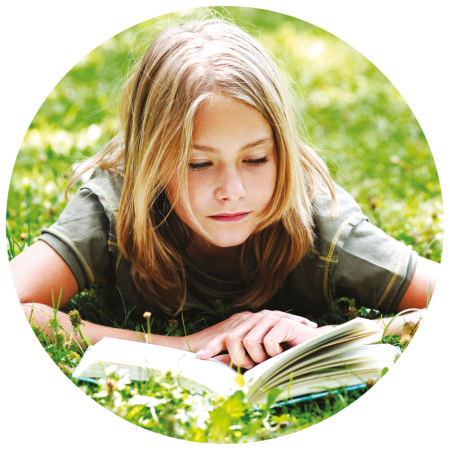 Girl reading on her tummy